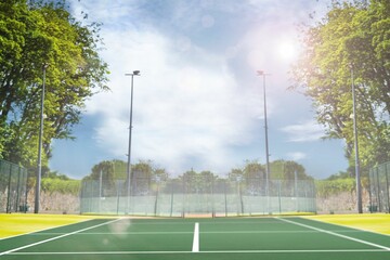 Composite image of tennis field on a sunny day