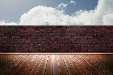 Flat design is showing wooden floor planks extending toward red brick wall under cloudy blue sky