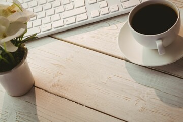 Keyboard with flower pot and coffee cup