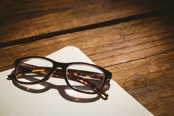 Black eyeglasses on table