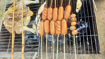 grilled chicken and Hot Dog with charcoal 