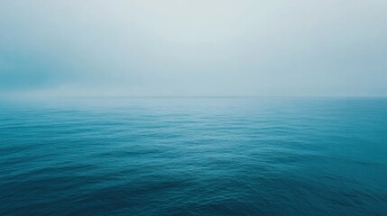 Obraz premium Tranquil Blue Ocean Horizon with Misty Sky background,generative Ai