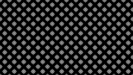 Seamless pattern of repeating white floral ornaments on a black background in a symmetrical arrangement