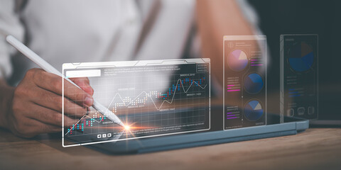 Businessman reading graph report and business statistics charts ,Analysis and improvement of corporate strategy ,Statistics and Data Concepts ,business growth graph ,Business analytics connected