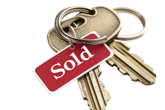 A set of keys with a "Sold" tag, symbolizing a successful property transaction. The keys are close-up, focusing on the shiny metal and the message on the tag