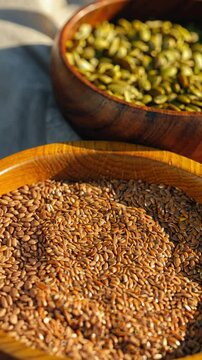 wooden bowl filled with seeds standing on wooden table rustic natural setting simple healthy snack