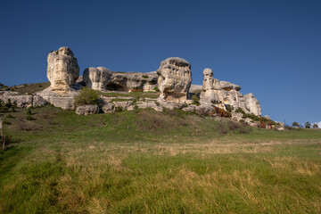 Large rocks made of large stones against the sky.
