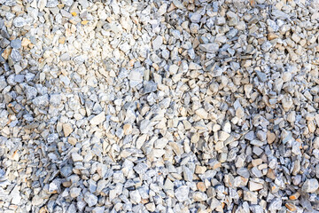Pile of natural gray gravel stones for construction and landscaping