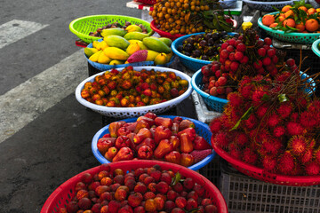 Vibrant tropical fruit market display with colorful exotic varieties in baskets