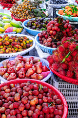 Vibrant tropical fruit display at outdoor market
