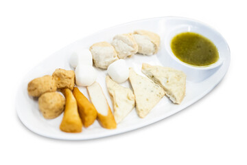 Top view of Boiled fish balls with seafood dipping sauce, focus selective