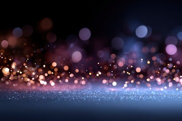 Fototapeta premium Abstract shot of bokeh lights in blue gold colors over a glittering surface
