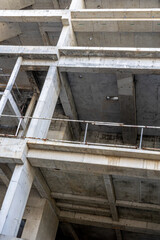 Industrial concrete construction site with exposed framework and multiple levels