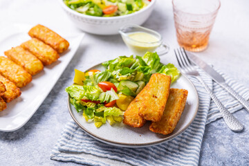 Fried potato pocked filled with cream cheese and herbs with mixed salad
