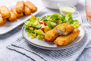 Fried potato pocked filled with cream cheese and herbs with mixed salad