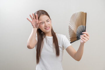 Suffering summer heat wave stroke, hot weather, tired asian young woman sweaty and thirsty,...
