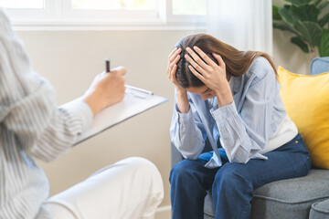 Psychology, depression. Suffer asian young woman consultation with psychologist while patient...