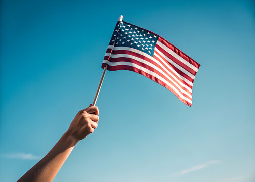 hand flag american mini stick closeup waving sky blue patriotism patriot USA celebration independence horizontal stock simple emotional background macro banner symbol red white summer


