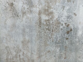 Cracked Weathered Concrete Wall Texture. Close-up of a cracked and weathered concrete wall with...