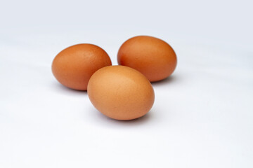 3 eggs of chicken on white background. nutrition. good protein