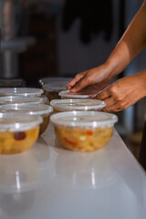 Woman Arranging Packaged Collagen Desserts for Small Business