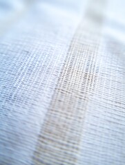 Textured white fabric creates blurry pattern