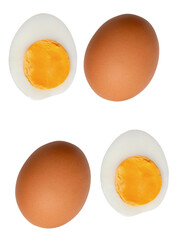 Top view set of two raw brown chicken eggs and two boiled or cooked eggs in two halves with egg...