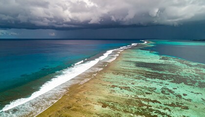 Fototapeta premium Aerial view of a tropical Thai island beach with blue ocean water and white sand, perfect for a summer travel vacation