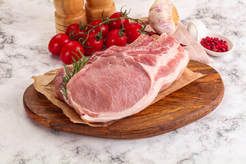 Raw potk loin steak with bone