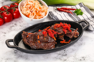 Baked beef cheeks with vegetables