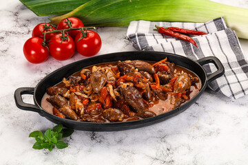 Baked chicken hearts with vegetables