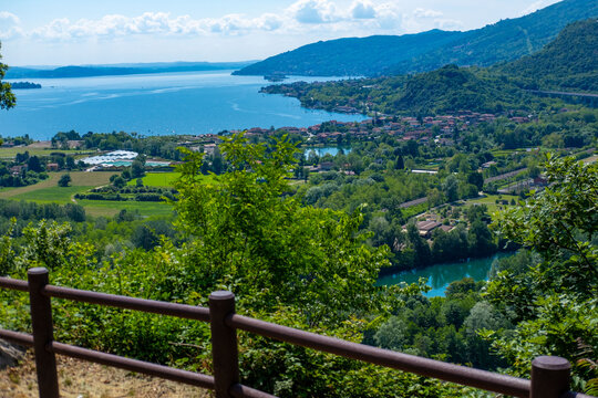 Maggiore Lake, mountains walk along Montorfano village, Hiking couple enjoying scenic mountain view, Province Verbano-Cusio-Ossola in Italian region Piedmont, Italian lakeside town - Powered by Adobe