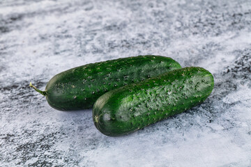 Ripe green raw two cucumbers