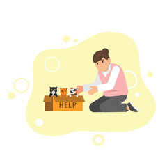 a person helping or adopting kittens from a box labeled. suggesting a scene of animal rescue or pet adoption. a message of compassion and care towards abandoned or needy animals.