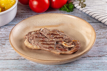 Grilled lamb steak with bone