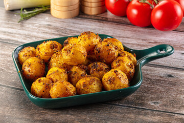 Baked small baby potato with herbs