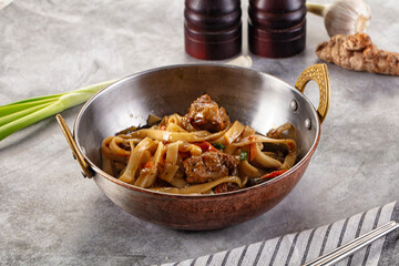 Asian cuisine udon with chicken and vegetables
