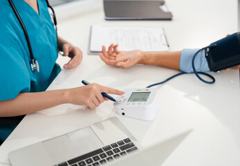 Blood pressure, man and doctor in office with discussion, help and advice for hypertension. Clinic,...
