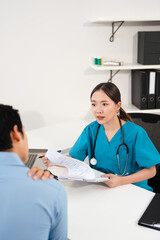 Fototapeta premium Asian medical doctor talking with male patient about shoulder pain in hospital. Physiotherapy, neck pain and doctor consulting for injury.