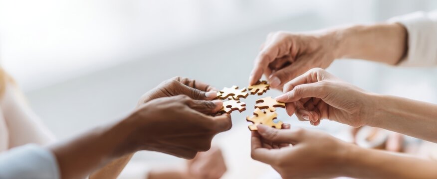The Hands Collaborating to Fit Together Puzzle Pieces in Unity