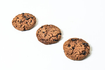 Close up view of three chocolate chip cookies isolated on white background. clipping path. 