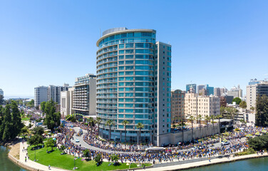 Golden State Warriors fans celebrate their team's championship win with a parade around Lake Merritt. People line the streets to cheer.  Oakland, California, USA. 12 June 2018.