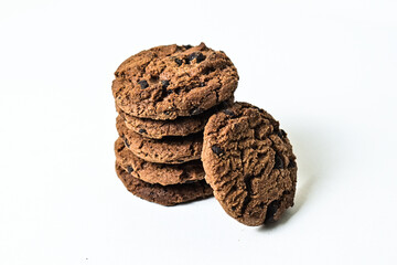 Pile or stack of chocolate chip cookies isolated on white background. Close up. clipping path. 