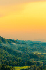 Obraz premium Vertical Horizon Sunset mountain range beautiful landscape mist foggy sunrise beam. Golden sky Mountain landscape mountain. Vertical Amazing Landscape cloud sky on sunrise. Gold sunlight heaven scene