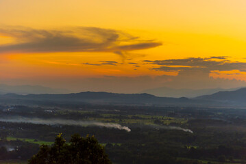 Sunset mountain range beautiful landscape mist foggy sunrise beam. Golden sky Mountain landscape...