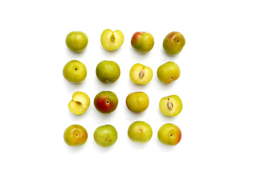 Fresh green plum fruit on white background.