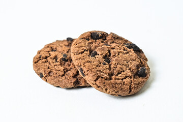 Close up view of two chocolate chip cookies isolated on white background. clipping path. pile, stack.