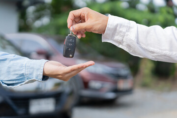 lease, rental car, sell, buy. Dealership manager send car keys to the new owner.  Sales, loan credit financial, rent vehicle, insurance,  renting, Seller, dealer, installment, car care business