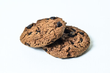 Close up view of two chocolate chip cookies isolated on white background. clipping path. pile, stack.