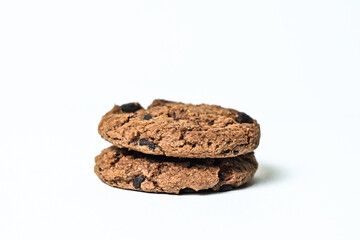 Side view of two chocolate chip cookies isolated on white background. Close up. clipping path. pile, stack.